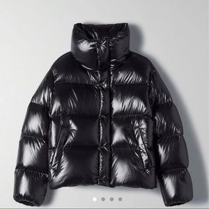 Black shiny TNA mega puff shorty in size small. Excellent condition. Barely worn